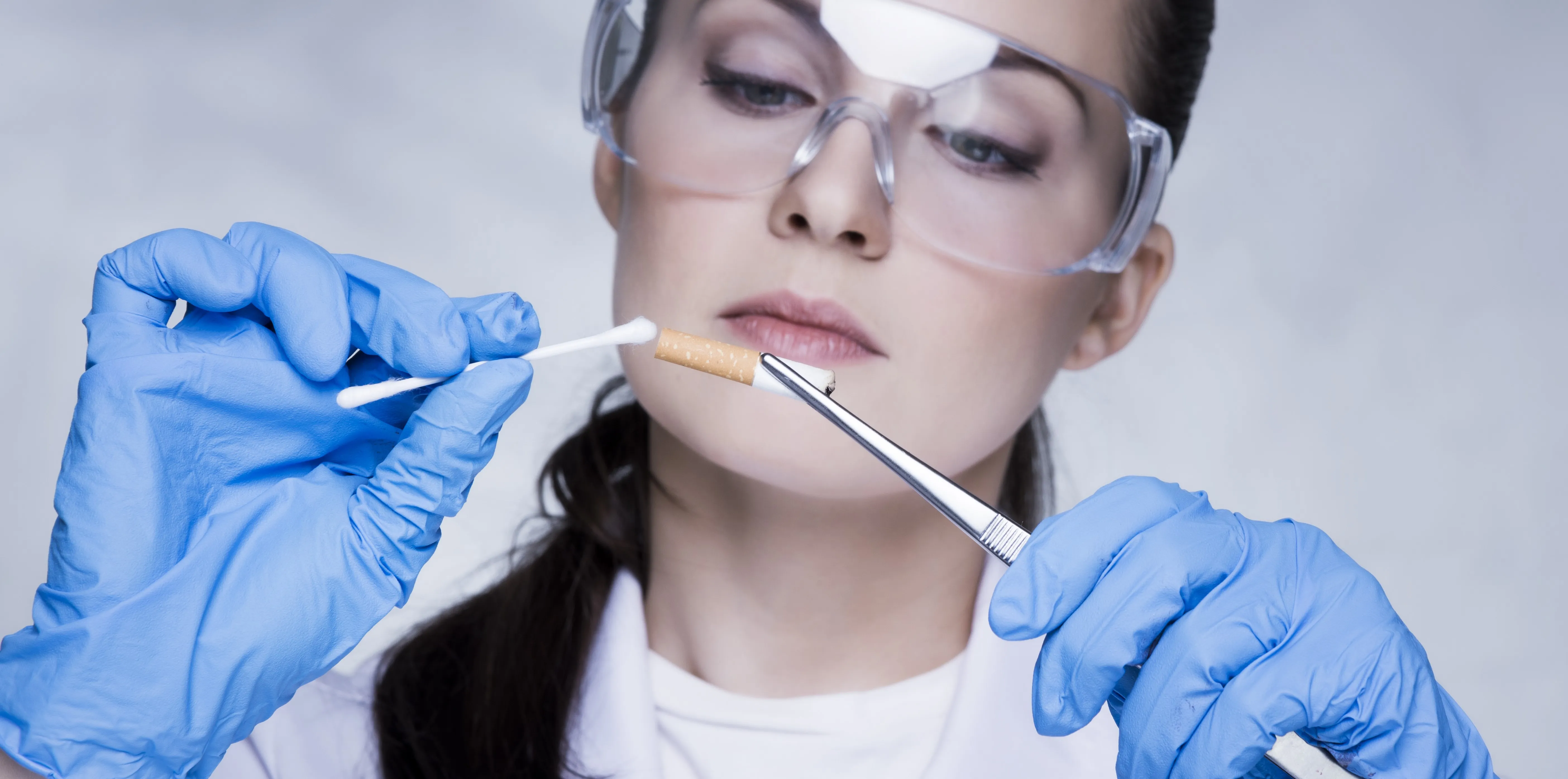 scientist testing cigarette