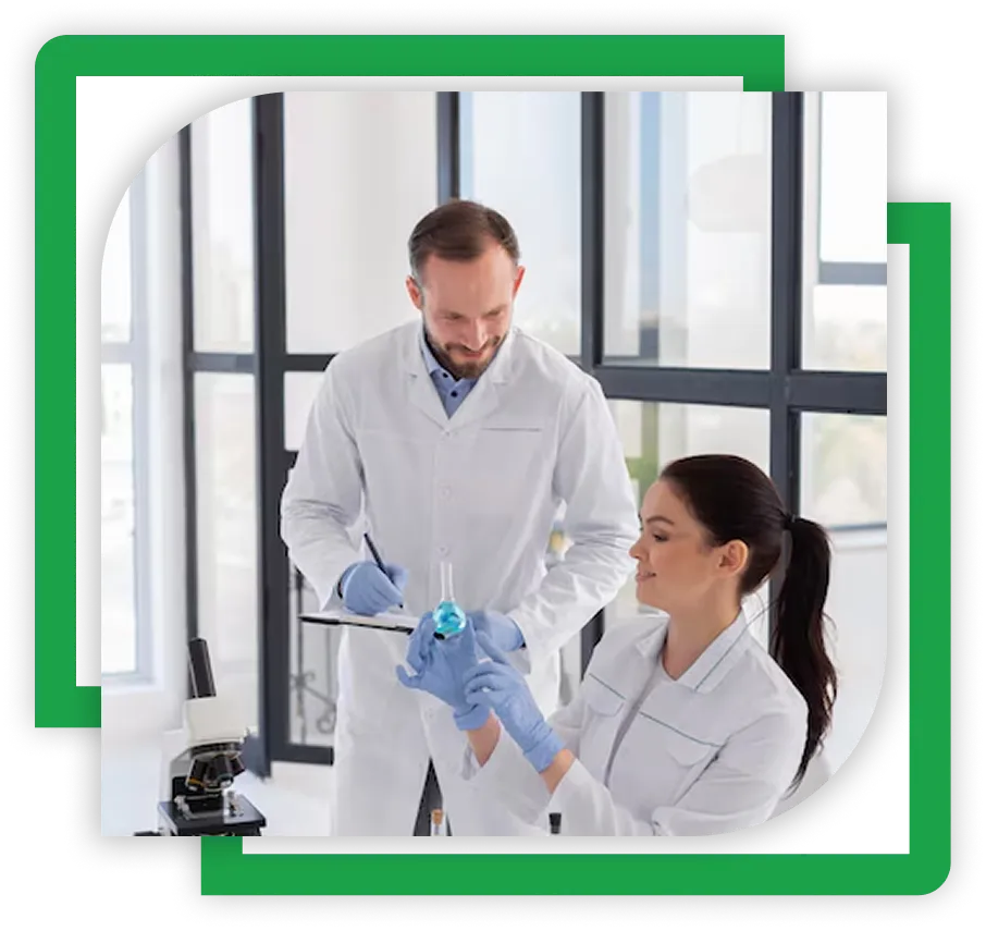 two laboratory technicians testing chemicals 