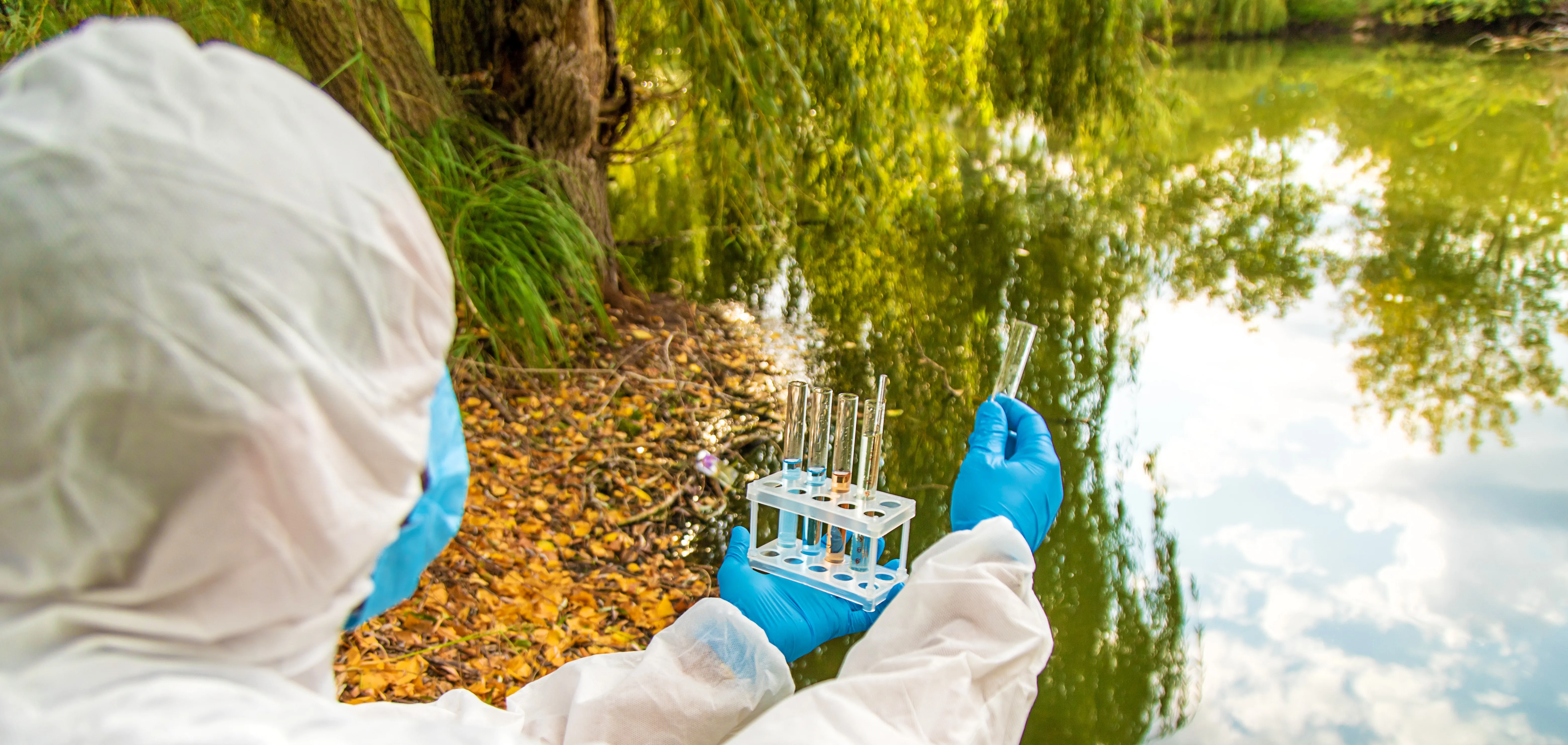 scientist testing water on field