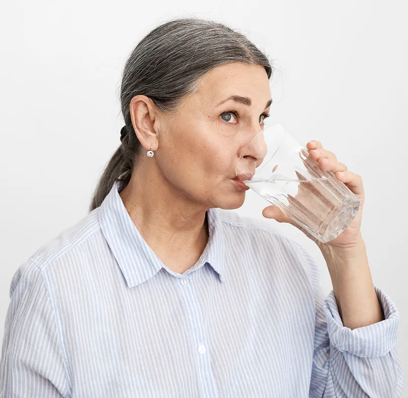 elder woman drinking water
